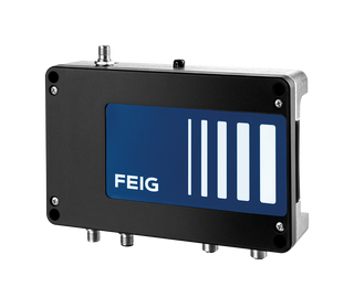 Close-up of an industrial RFID scanner reading a tag on a metal component