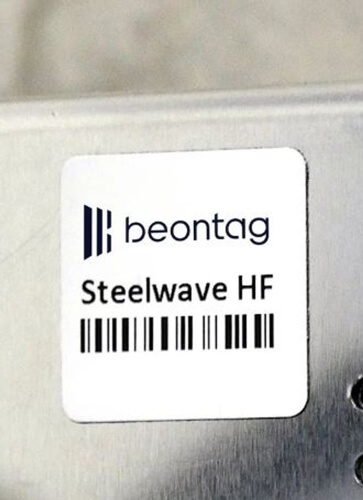 Beontag NFC tag on a brushed metal surface.