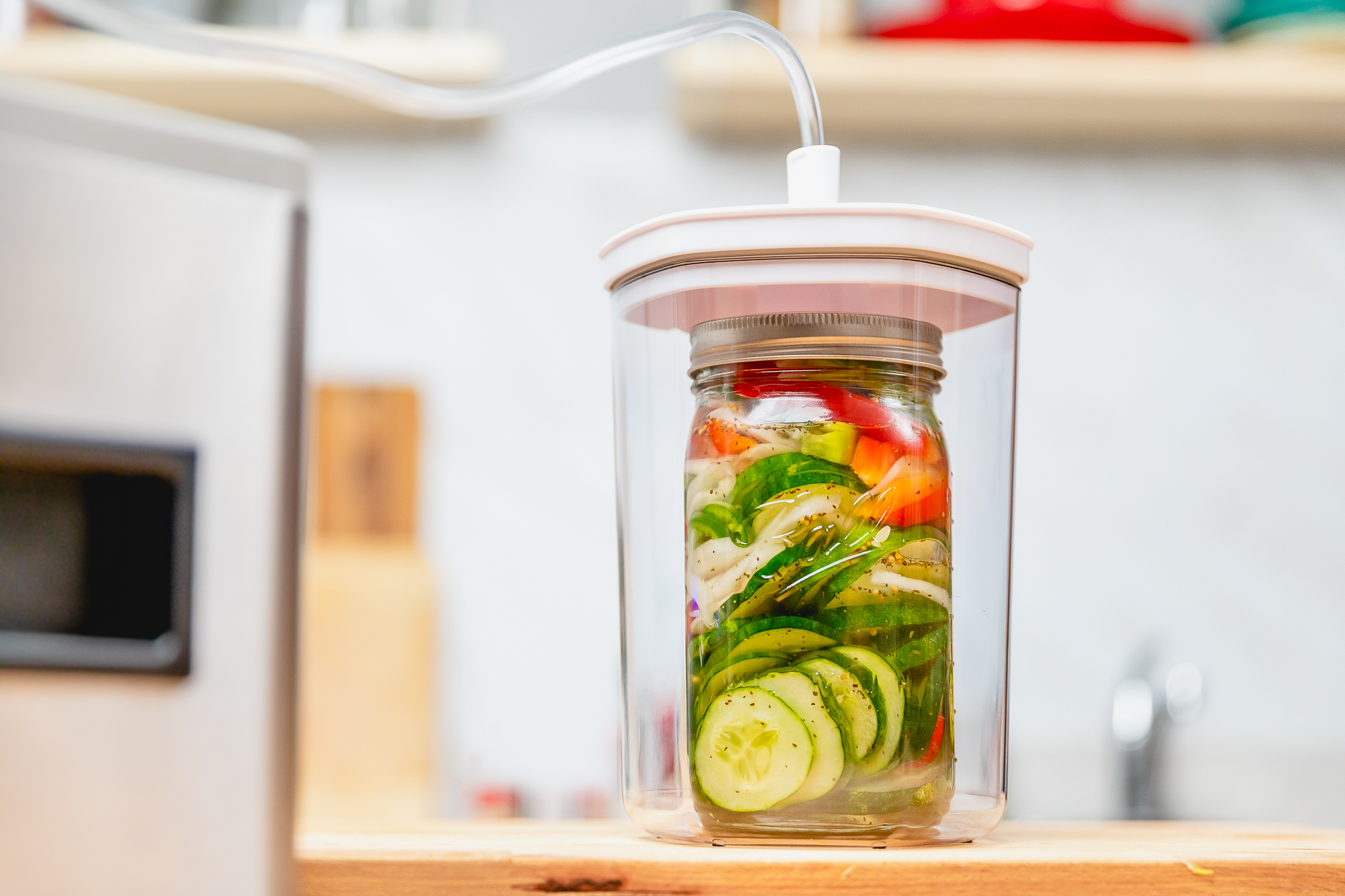Garden Fresh Pickled Cucumber Salad Vacuum Sealed in a Mason Jar Using