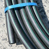 Close up of rainwater pipe showing green stripes.