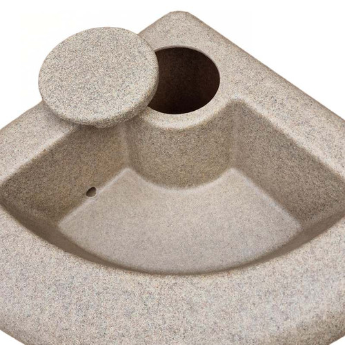 Showing shape of water butt from above, along with planter drain hole and lid over cleaning hole.
