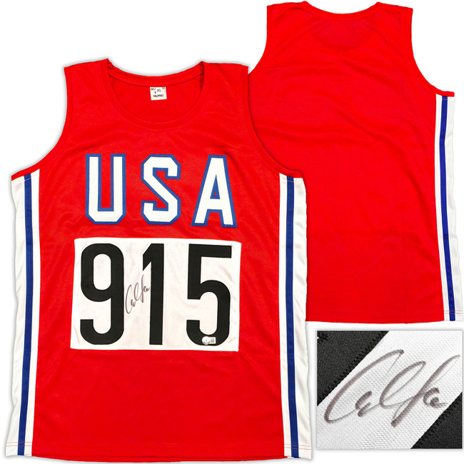 Team USA Carl Lewis Autographed Red, White and Blue Jersey Beckett BAS Witness Stock #227966