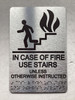 FD NYC IN CASE OF FIRE USE STAIRS UNLESS OTHERWISE INSTRUCTED SIGN WITH RAISED LETTERS SIGN