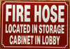 FIRE HOSE LOCATED IN STORAGE CABINET IN LOBBY COMPLIANCE SIGN