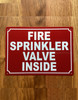fire-sprinkler-valve-inside-red-safety-sign.jpg