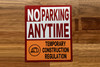 no-parking-anytime-both-side-arrow-sign-white-equipment-notice.jpg