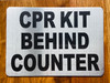 silver-cpr-kit-behing-counter-building-notice.jpg