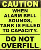 CAUTION WHEN ALARM BELL SOUNDS, TANK IS FILLED TO CAPACITY Fire Deparment Sign