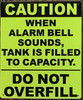 CAUTION WHEN ALARM BELL SOUNDS, TANK IS FILLED TO CAPACITY Hotel Sign