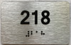 BRAILLE APARTMENT NUMBER 218 SIGN
