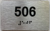BRAILLE APARTMENT NUMBER 506 SIGN