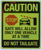 CAUTION ONLY ONE VEHICLE AT A TIME DO NOT TAILGATE HPD SIGN