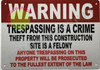 Warning: TRESPASSING is A Crime Theft from This Construction SITE is A Felony HPD SIGN