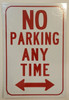 NO PARKING ANY TIME WITH DOUBLE ARROW BUILDING SIGN