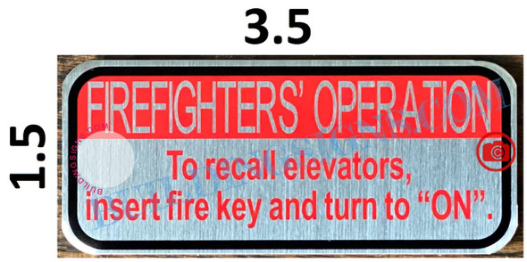 FIREFIGHTERS OPERATION TO RECALL ELEVATORS INSERT FIRE KEY AND TURN TO ON SIGN- SILVER WITH RED HEADER