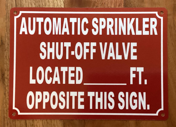 NYC AUTOMATIC SPRINKLER SHUT OFF VALVE LOCATED FT OPPOSITE THIS SIGN SIGN