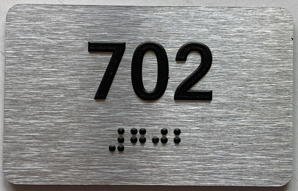 ADA APARTMENT NUMBER 702 SIGN
