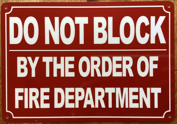 DO NOT BLOCK BY ORDER OF FIRE MARSHAL SIGN