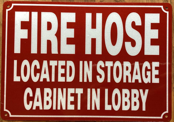 FIRE HOSE LOCATED IN STORAGE CABINET IN LOBBY SIGN
