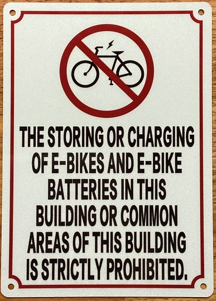 the-storing-or-charging-of-e-bikes-and-e-bikes-batteries-sign-5-x-7-inches-white-aluminum-sign.jpg