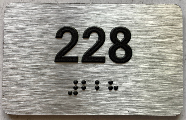 ADA APARTMENT NUMBER 228 SIGN