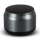 Auris Bluetooth speaker in metallic silver with a black base. Compact design with a textured top.