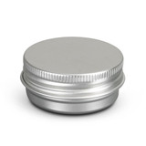 A silver lip balm tin with a smooth, rounded top and a ribbed edge. It has a minimalist design and a logo.