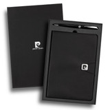 A black notebook and silver pen presented in a sleek black gift box, featuring a logo on the notebook.
