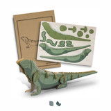 A green tuatara wooden model partially assembled, with detailed assembly instructions displayed beside it.