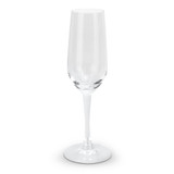 A clear glass champagne flute with a slender stem and wide base. It features a logo on the glass.