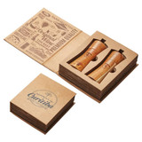 A salt and pepper set in wooden-coloured holders, presented in a decorative box with branding.
