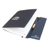 A navy blue A5 journal book with spiral binding, featuring lined pages and a pocket for pens. It has a logo on the cover.
