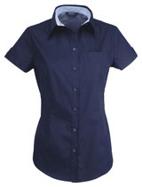 A short-sleeved ladies' shirt in navy blue featuring a button-up front and a chest pocket. Includes a logo.