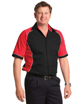 A button-up shirt featuring a tri-colour design in black, red, and white, with a logo on the chest.