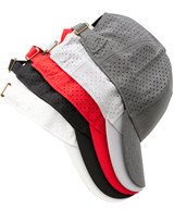 A collection of 4-way stretch laser cut runner's caps in grey, black, white, and red, featuring a logo.