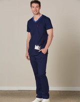 A navy short-sleeve scrub top with a contrast pocket, featuring a logo, paired with matching trousers.