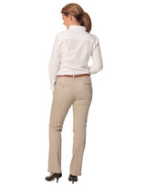 Women's chino pants in beige, featuring a straight leg design and pockets, paired with a white shirt.