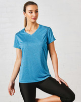 A blue short sleeve tee with a v-neck design, featuring a logo on the front, paired with black athletic pants.