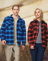 A blue and black quilted flannel shirt and a red and black quilted flannel shirt on two models. Both shirts have pockets and a logo.