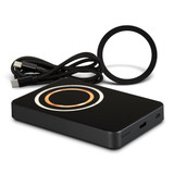 A black wireless charging power bank with a circular charging area, USB cables included. Features one logo.