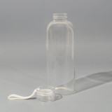 A drink bottle made of clear borosilicate glass with a removable cap and a loop for easy carrying.