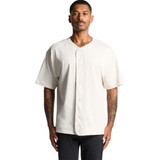 A heavy baseball jersey in a cream colour with a button front and short sleeves. It features a logo on the chest.