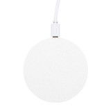 A round, white wireless charger with a textured surface and a connected charging cable.