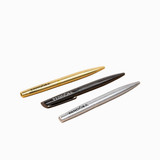 Three metal ballpoint pens in gold, black, and silver, featuring branding on the side.