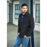 A black quilted jacket with a collared neck, worn by a man, paired with blue jeans. It features a brand logo.