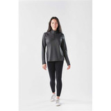 A long sleeve, quarter-zip jumper in dark grey, paired with black leggings and white sneakers, featuring a logo.