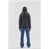 A grey women's fleece full zip hoody, viewed from the back, paired with blue jeans. Includes a hood and has a logo.