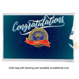 A die struck soft enamel badge in gold, placed on a decorative blue background with a "Congratulations" design.