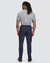 Flexi work pants in navy, featuring a flexible fit and water-repellent fabric. The model is seen from the back.