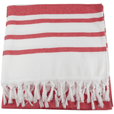 A Turkish beach towel with red and white stripes, featuring decorative fringes along the edge.